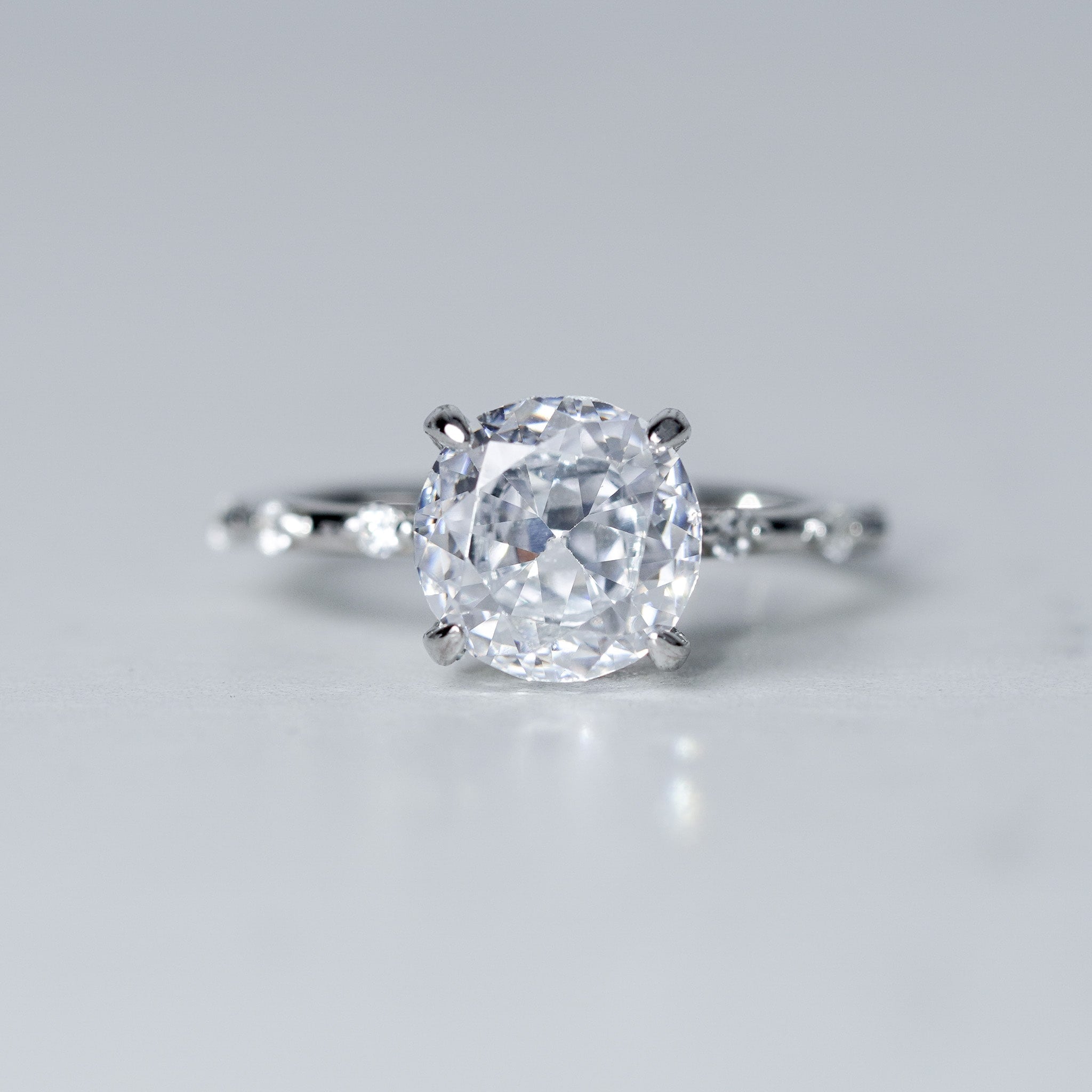 Round Radian Engagement Ring - Side Dots - Simulated Diamond