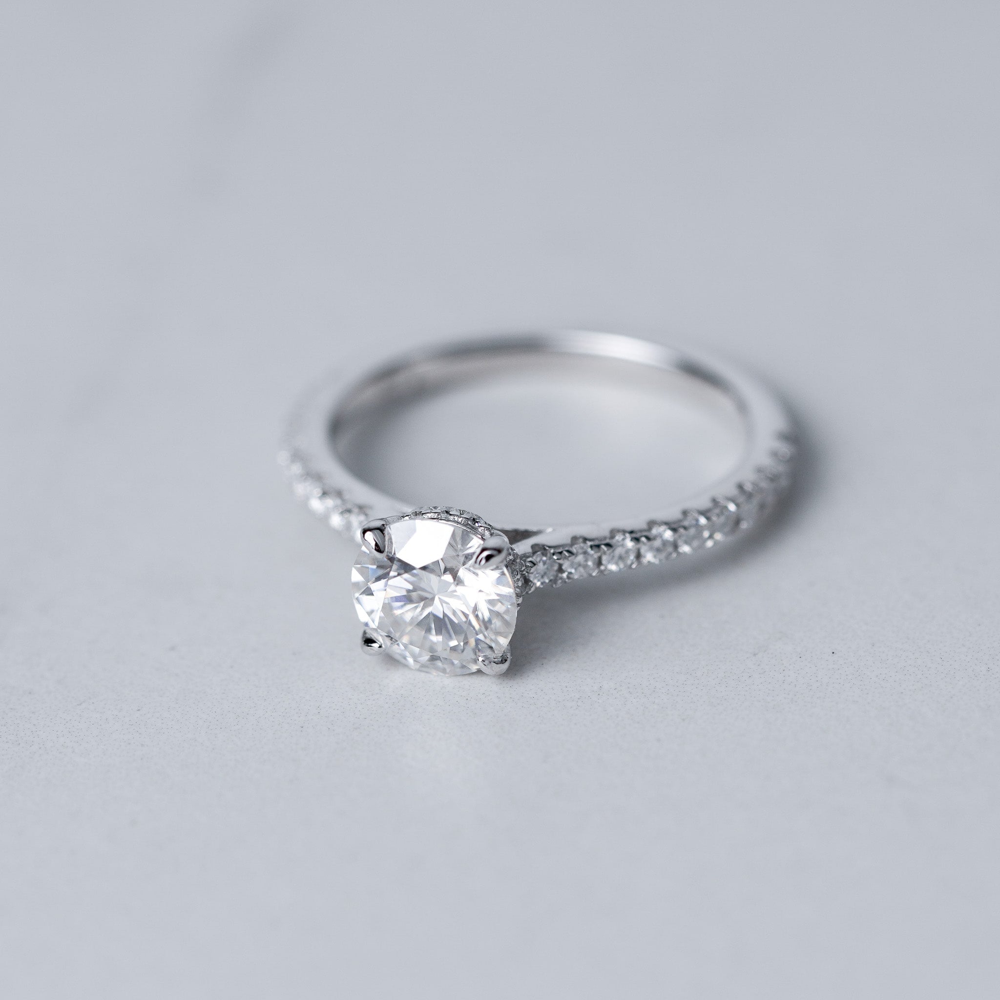 Moissanite Solitaire Engagement Ring - With Pave Side Stone