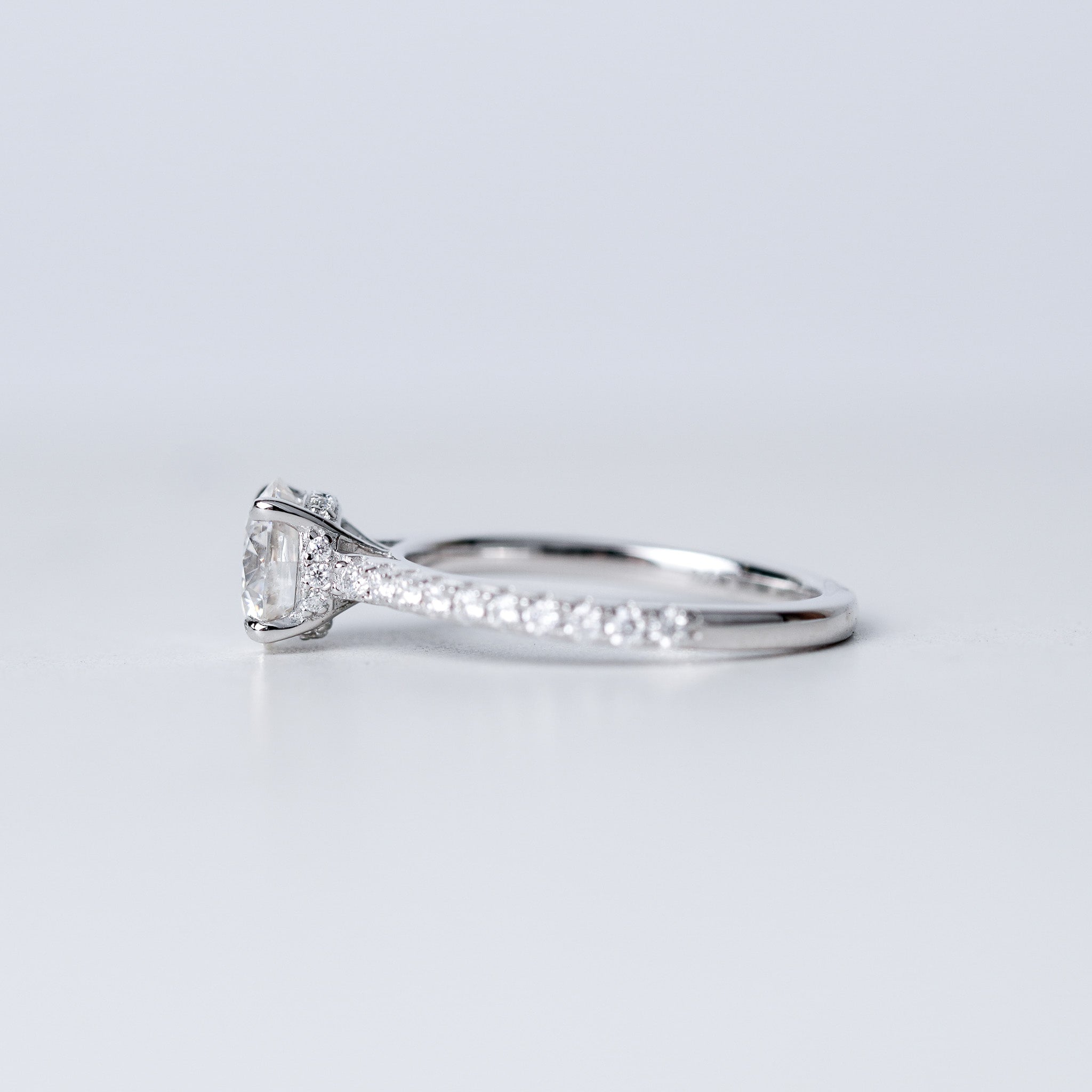 Moissanite Solitaire Engagement Ring - With Pave Side Stone