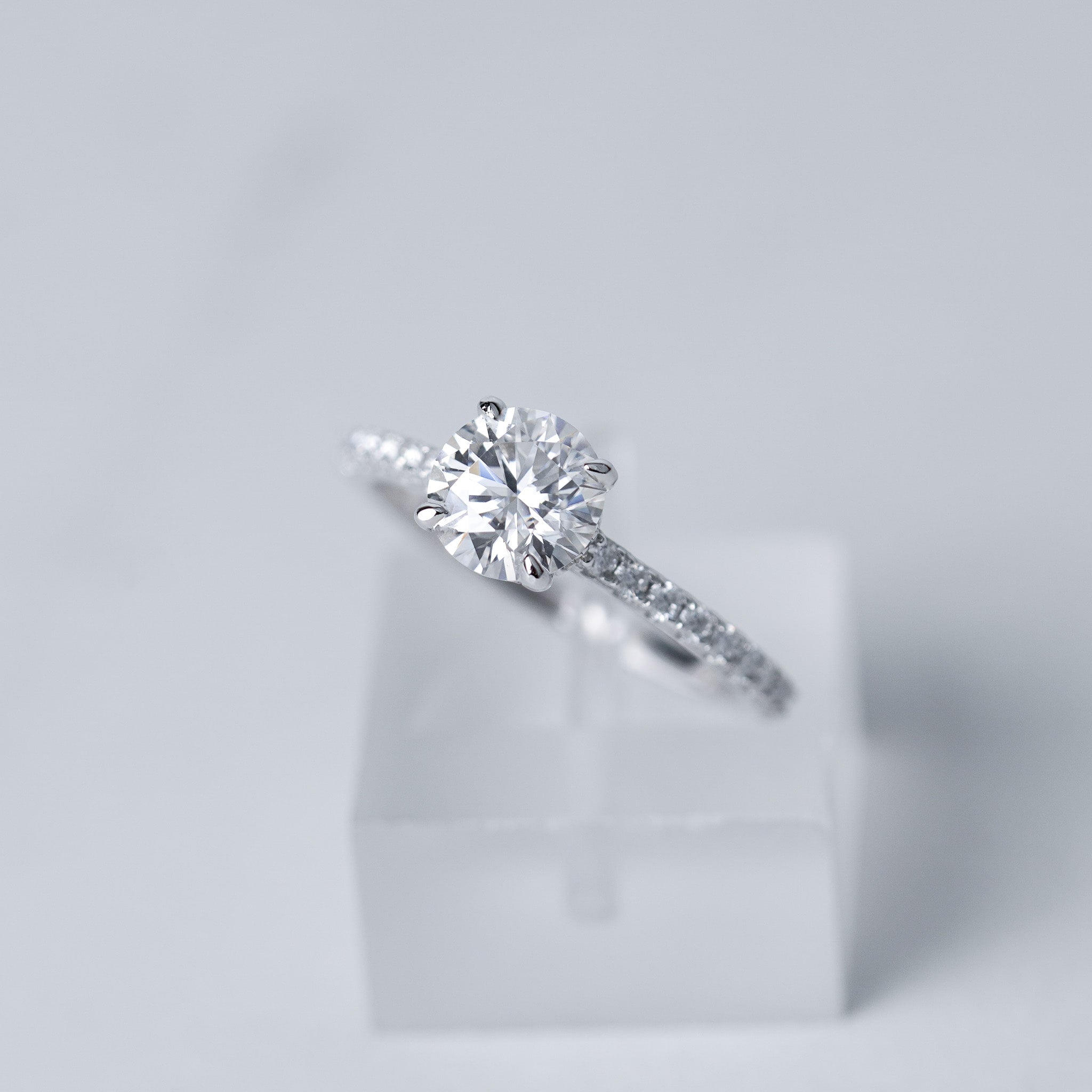 Moissanite Solitaire Engagement Ring - With Pave Side Stone