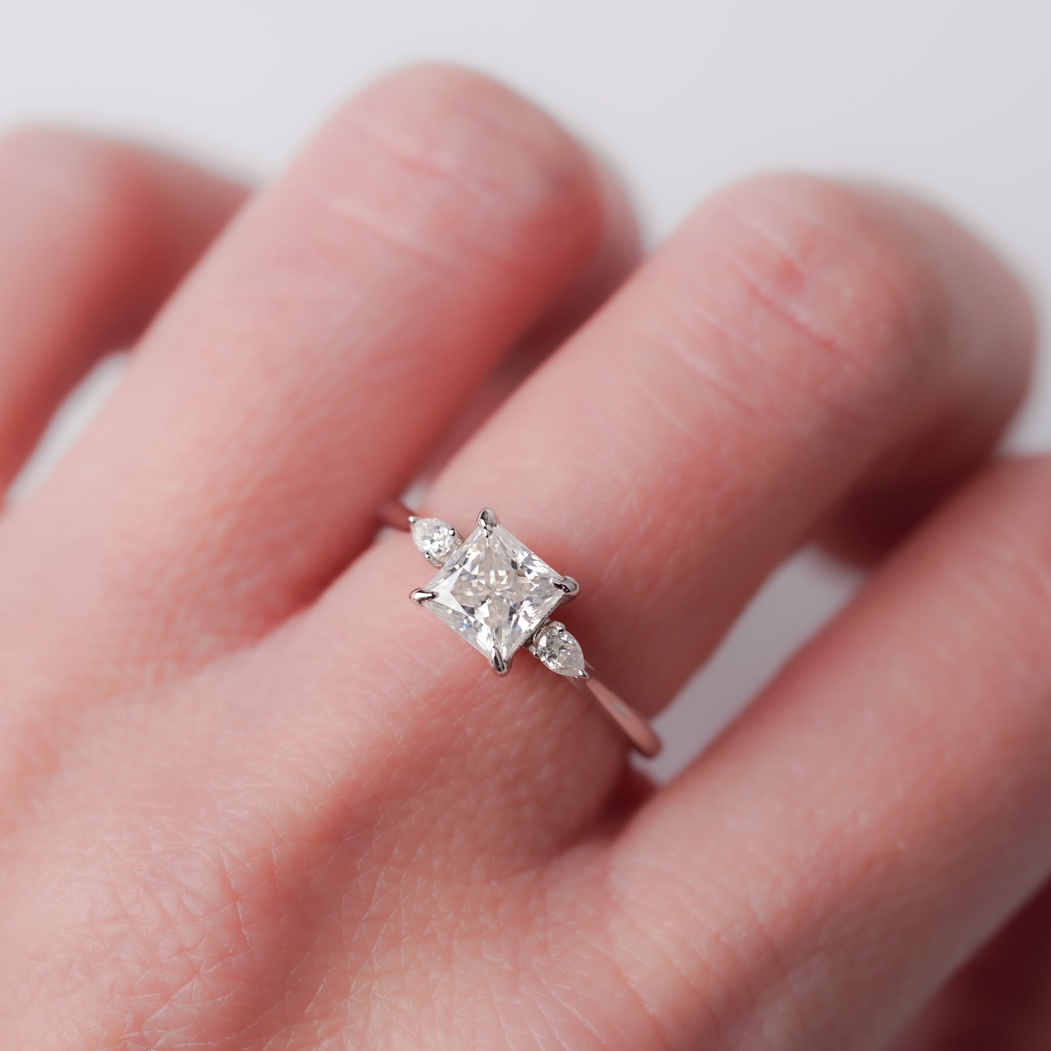 Princess Moissanite Ring - With Pears Side Stone