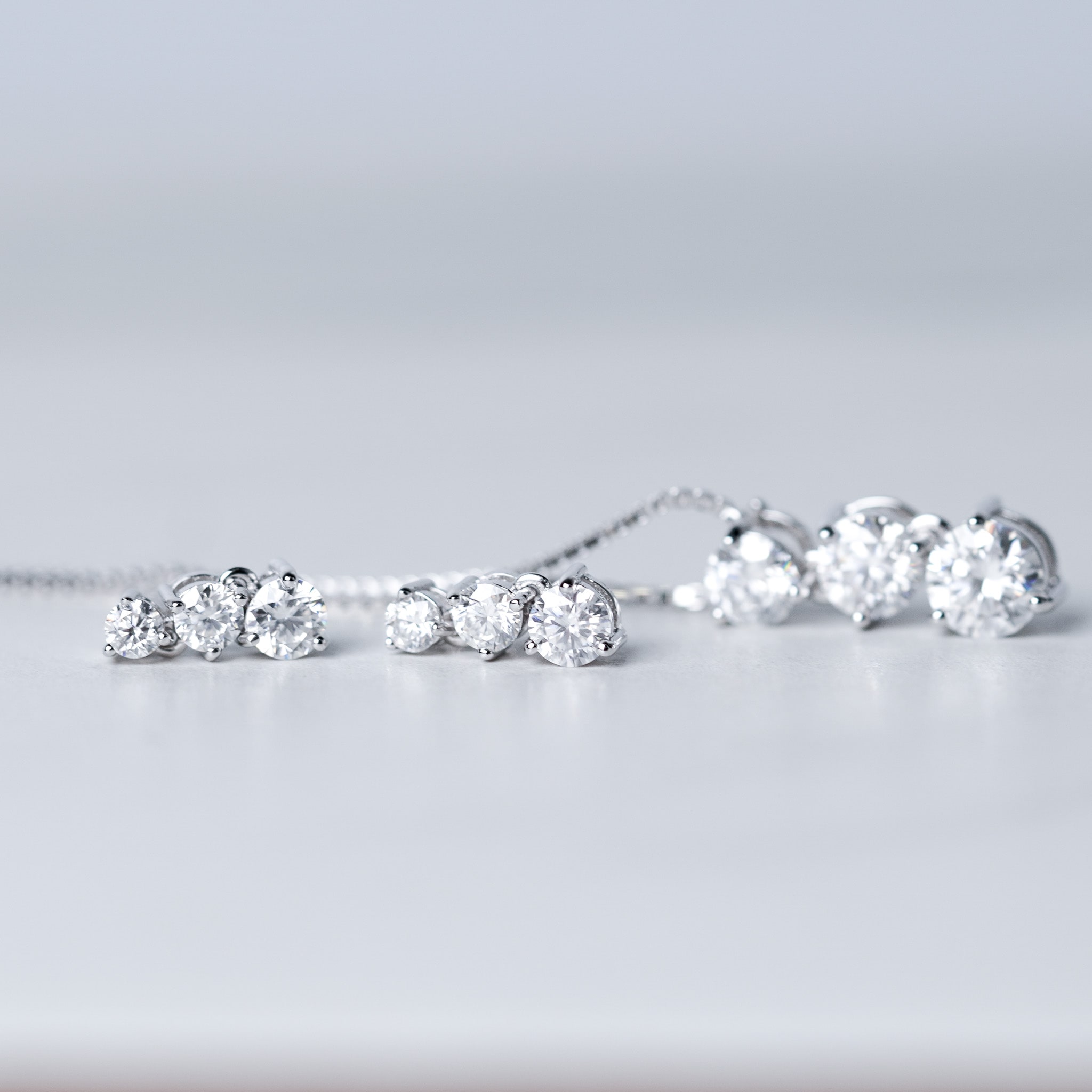 Three-Stone Drop Dangling Earrings in Sterling Silver – Moissanite