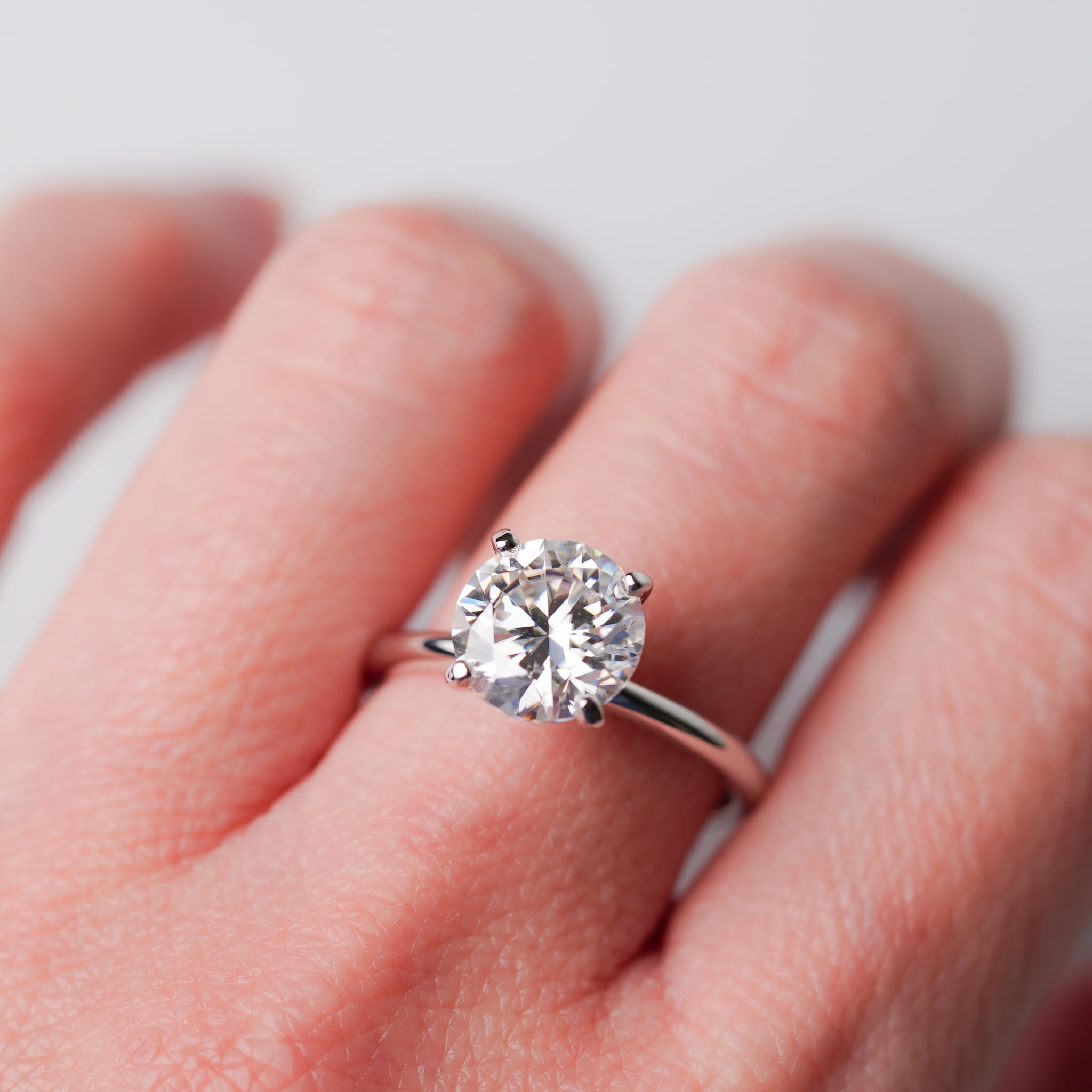 Four Prongs - Round Solitaire Engagement Ring - Moissanite